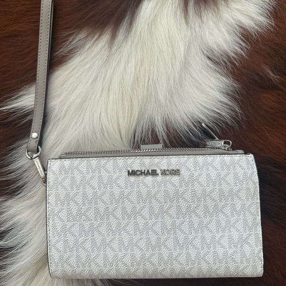 Michael Kors Handbags - Michael Kors Gray Clutch with Silver-Tone Hardware